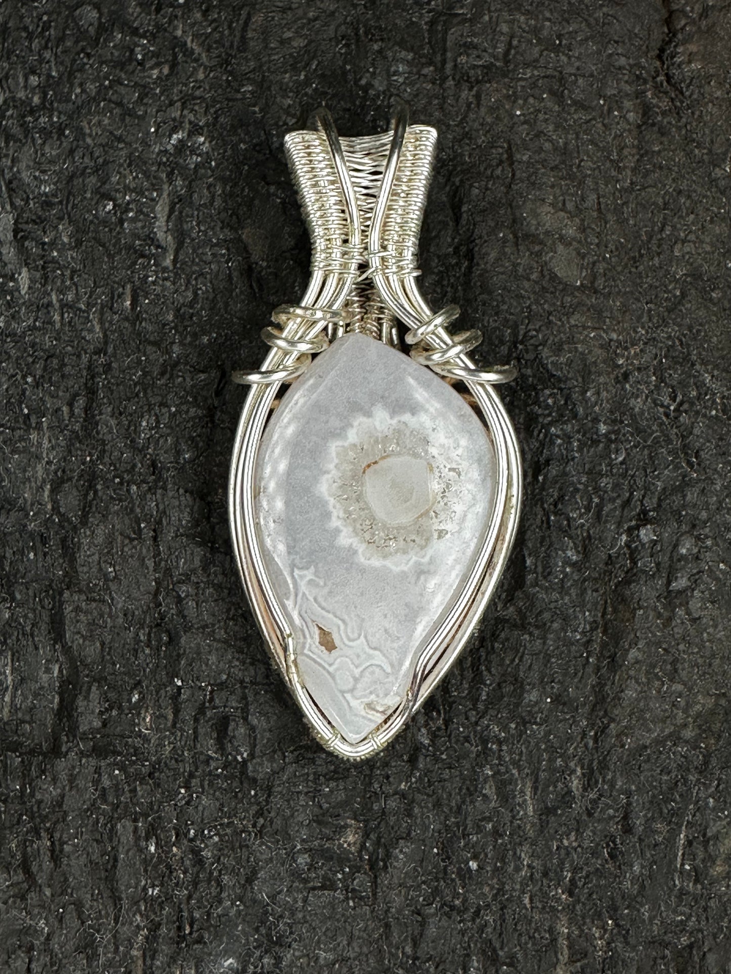 The Stillness natural Snow White Agate pendant with silver-coloured wire wrapping