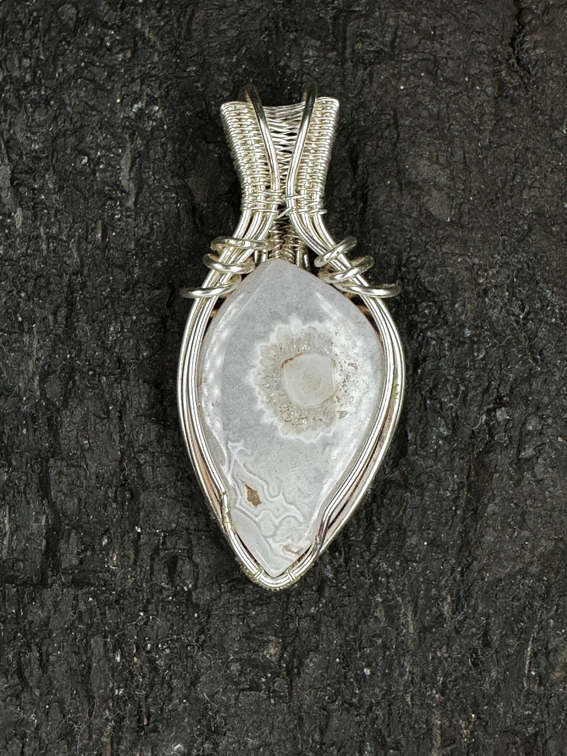 The Stillness natural Snow White Agate pendant with silver-coloured wire wrapping