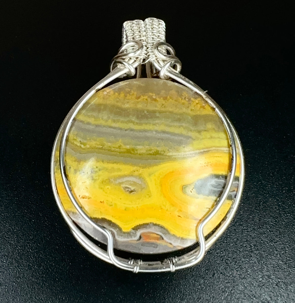The Awakening natural Bumblebee Jasper pendant with yellow and grey banding in silver-coloured wire